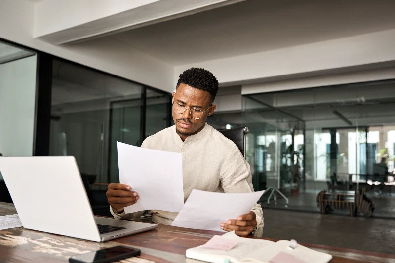 Home 141 Underwriter reviewing loan docs