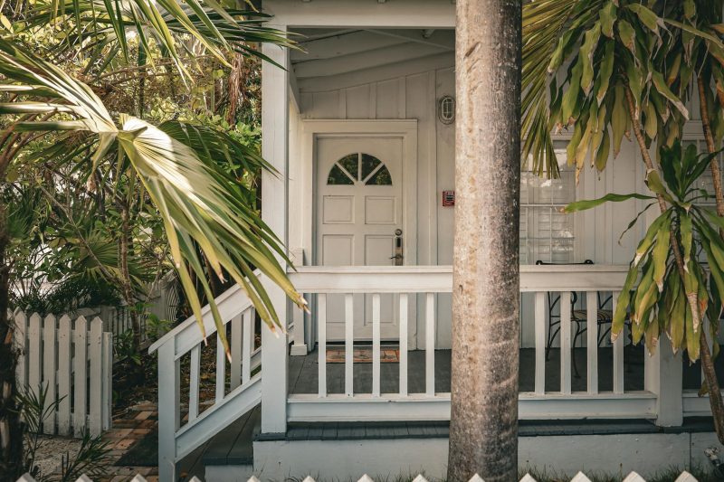 Home 139 Charming tropical front porch with palm trees and white wood