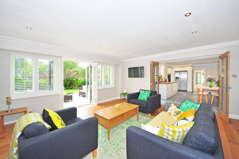 Modern living room with open plan kitchen and garden view br 1787072999